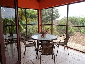 Breakfast, read, work, or watch the hummingbirds on the screened patio