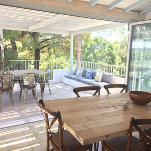 Bifold doors leading out to shaded outside dining area