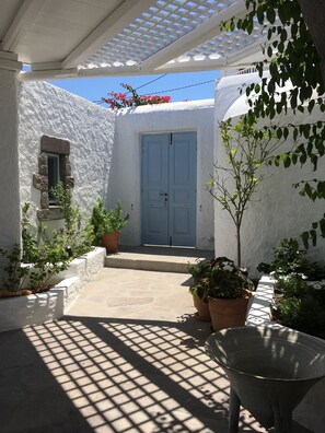 Upper courtyard with summer shower area on the right hand side 