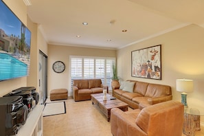 Living area facing patio and entertainment center