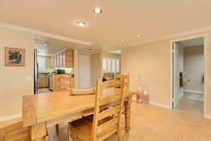 Looking at Entry door, den and bathroom.