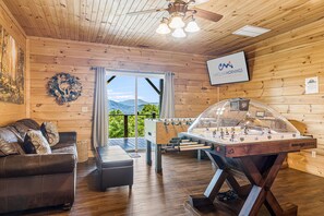 Lower Living Area w/ TV, Foosball, Hockey Table & Retro Arcade