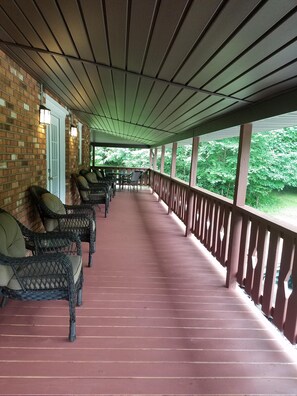 Covered porch with plenty of seating for everyone.