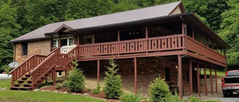 Situated on the most peaceful private 14 acres with a 106 ft. long covered porch
