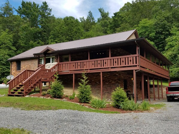 Situated on the most peaceful private 14 acres with a 106 ft. long covered porch