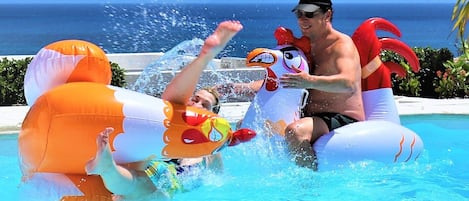 Chicken fight in the pool overlooking the Caribbean Sea