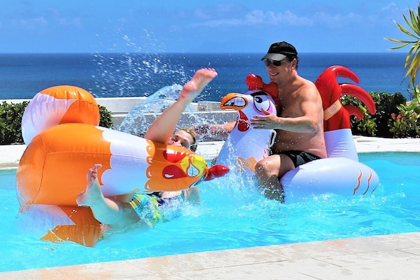 Chicken fight in the pool overlooking the Caribbean Sea