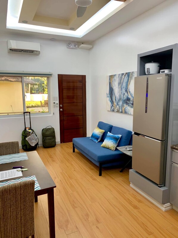 Sleeper Sofa, Refrigerator and Dining Area
