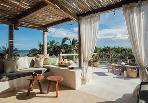 Roof Terrace: A spacious area with sunbeds and hammocks.