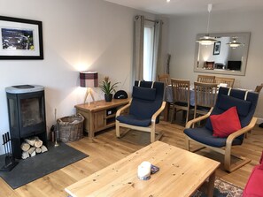 Couch and comfortable seating for six people. Log fire, smart tv. Dining table .