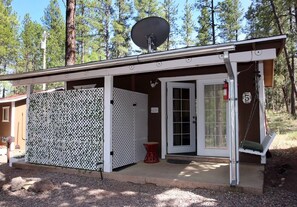 Porch with swing, private jacuzzi tub, picnic table and grill. 