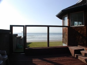 Fenced courtyard with glass wall windbreak