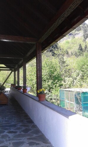 South side view of the valley, table and deck chairs