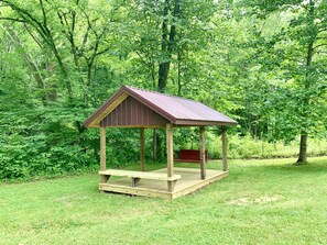 New 10x16 shelter with swing & bench for relaxing in the backyard.