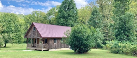 The Cozy Cabin with Full Upstairs Extending
Over the Front Porch