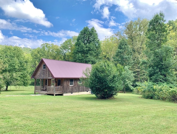 The Cozy Cabin with Full Upstairs Extending
Over the Front Porch