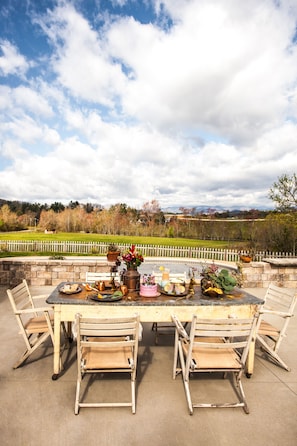 Dine al fresco by the pool with views of Mt Pisgah. 
