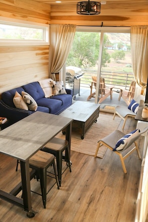 Take a seat indoors or out, relax and enjoy the amazing views! As a bonus, the sofa opens into a queen-sized sleeper.