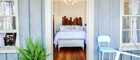 Looking into the main bedroom from its private screened porch.