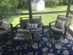 Relax in the comfort of the screened deck