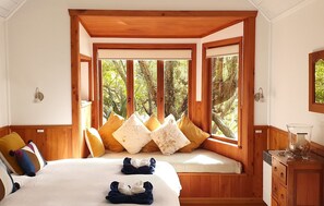 Super king bed and and cosy window seat overlooking the river
