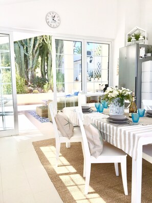 bright kitchen , 3 sides glass windows .