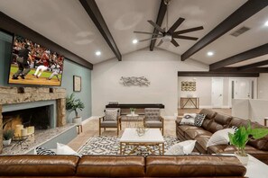 Embrace the warmth of our inviting living area, where rustic charm meets modern elegance.