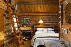 Queen bed, gas fireplace, ladder up to BainUltra whirlpool bathtub