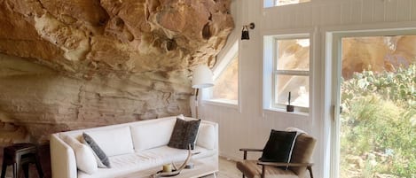 Living room area built into the sandstone rock face