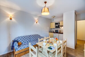 Prepare meals in the kitchenette and enjoy them at the dining table.