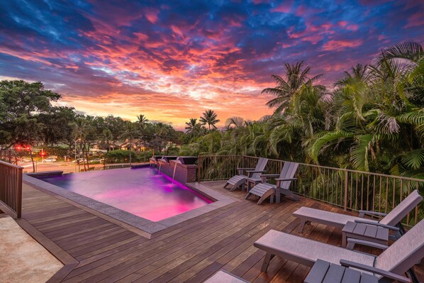 Enjoy evening swims in the pool with sunset lighting, offering a spectacular ambiance for both relaxation and fun in Lahaina.