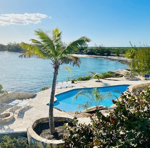 Pool with beach on estate in background