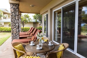 Relax on the chaise lounges or enjoy your morning cup of coffee on your private lanai