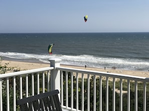 Kite surfing on the beach in front of the house