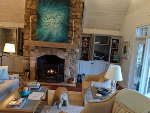 Living room - elephant & bear foot stools, gas fireplace, very comfortable
