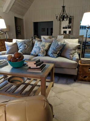 Large living room sofa facing Arm Chairs and porch