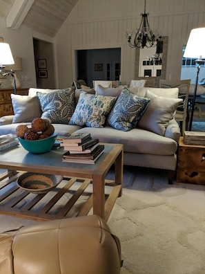Large living room sofa facing Arm Chairs and porch