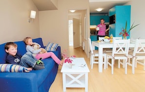 Sink into the cozy sofa after a day exploring the area.