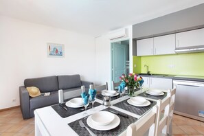 Eat breakfast at the wooden dining table with seating for everyone.