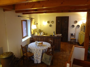 The house has lots of charm--old beams, traditional tiles, antique doors and kitchen counter.