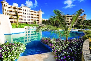 Two of the residence buildings and view of the upper pools.