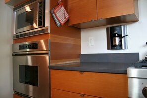 Built in Dacor oven & 2 cup coffee maker.  Quartz countertops