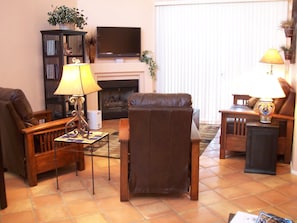 Living room with gas fireplace. Sliding glass patio doors out to deck