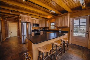 Fully stocked kitchen with radiant heated floors throughout