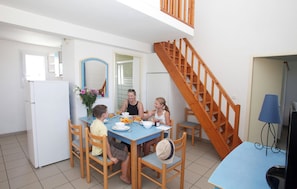 The living area is bright and cozy, perfect for relaxing after a wonderful day.