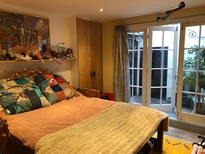 Bedroom three- Kingsize bed with doors onto small court yard