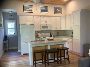 Fully stocked kitchen, tall ceilings and great natural lite.  
