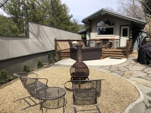 Fire pit area with firewood provided.