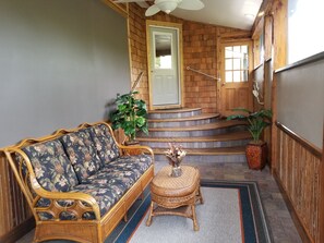 Covered porch entry into the house.