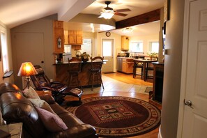 View of open Living Area, Kitchen, & Dining Area from hallway.